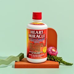 Front of bottle of Heal Quick Heart Miracle liquid Heart Supplement displayed with a flower